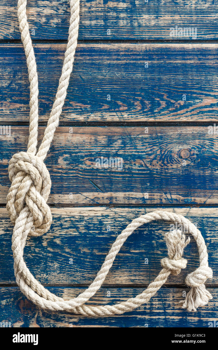 marine rope on wooden background Stock Photo - Alamy
