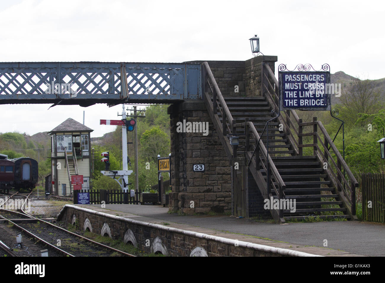 The station at Embsay on the preserved Embsay and Bolton Abbey Railway near Skipton with restored footbridge and period details Stock Photo