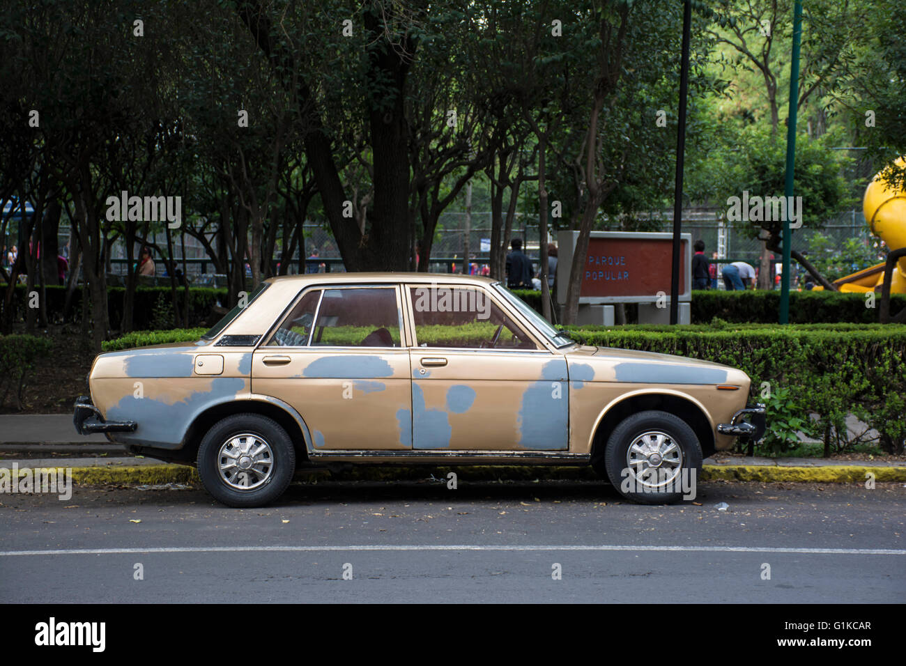 Old car in front  f a park, mexico city, mexico. Stock Photo