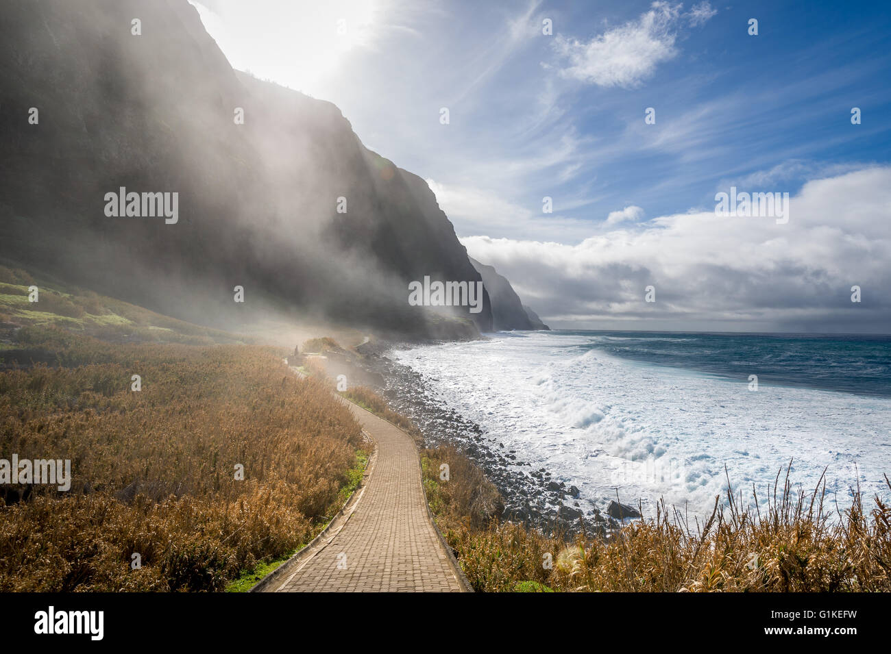 Madeira island wild bay with mountains in fog Stock Photo