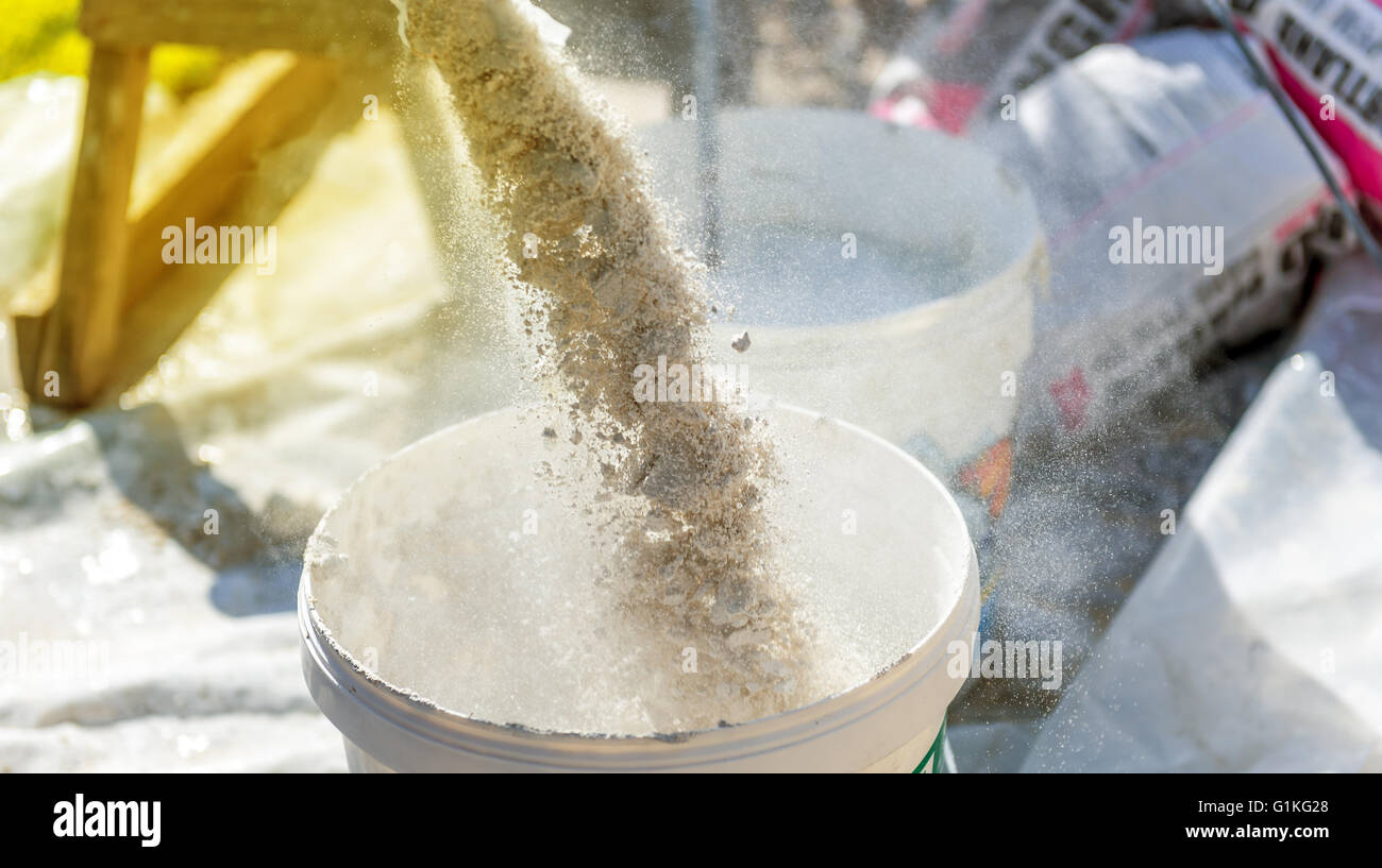 preparation of a plaster in a bucket Stock Photo Alamy