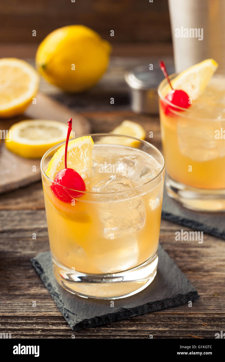 Homemade Whiskey Sour Cocktail Drink with a Cherry Lemon Stock Photo Alamy