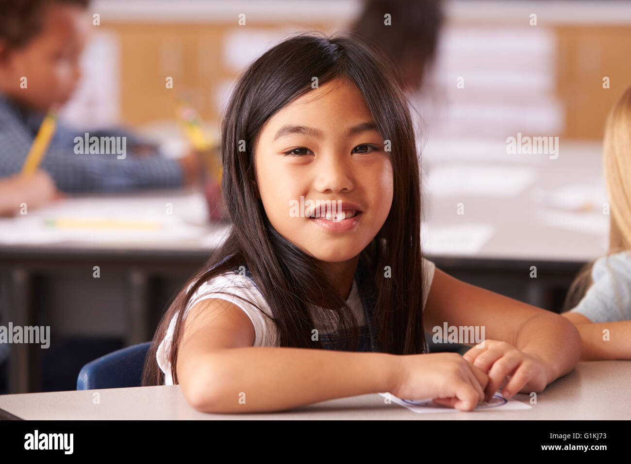 Portrait of Asian girl in elementary school class Stock Photo