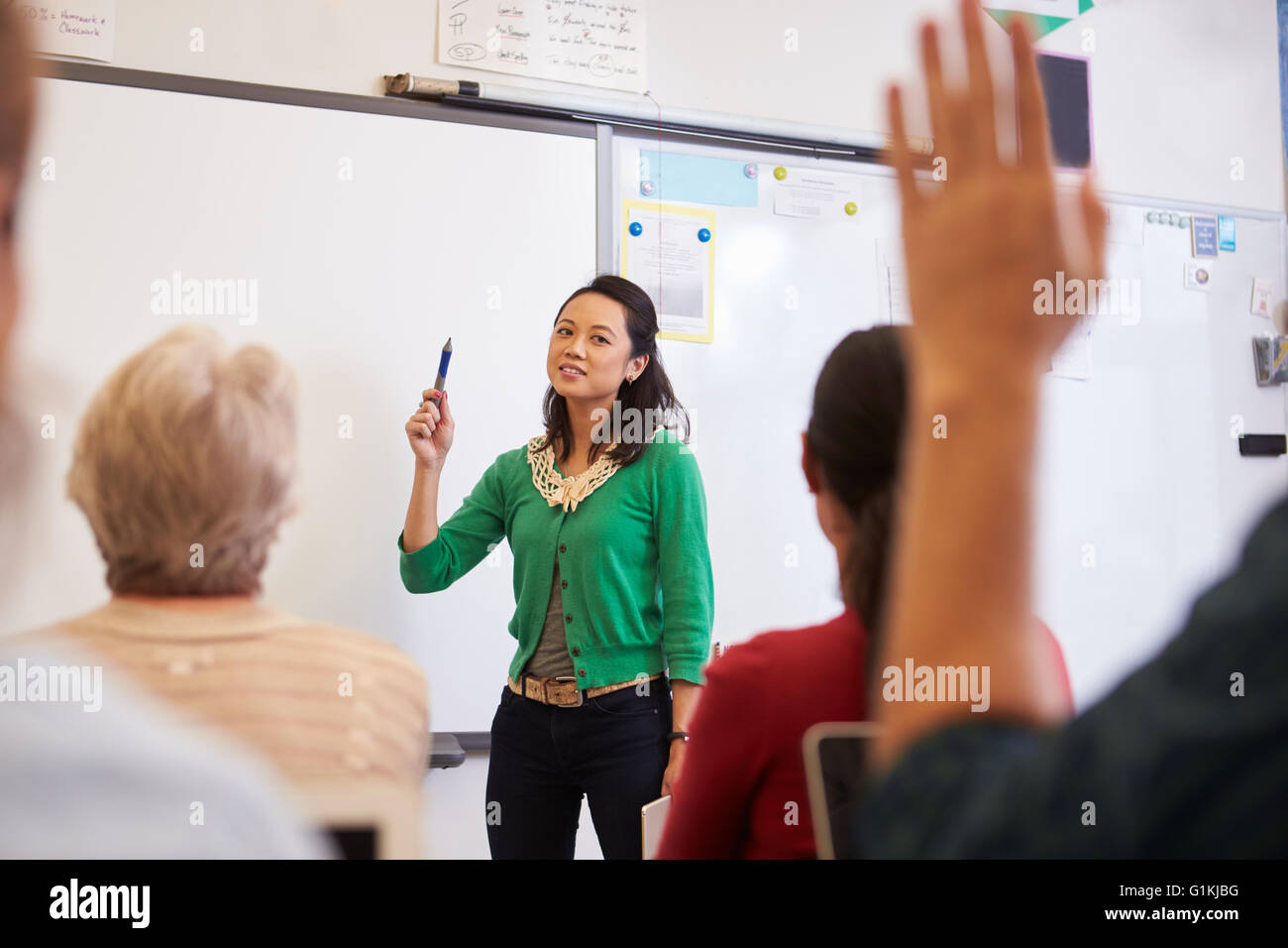 Teacher in front of students at an adult education class Stock Photo