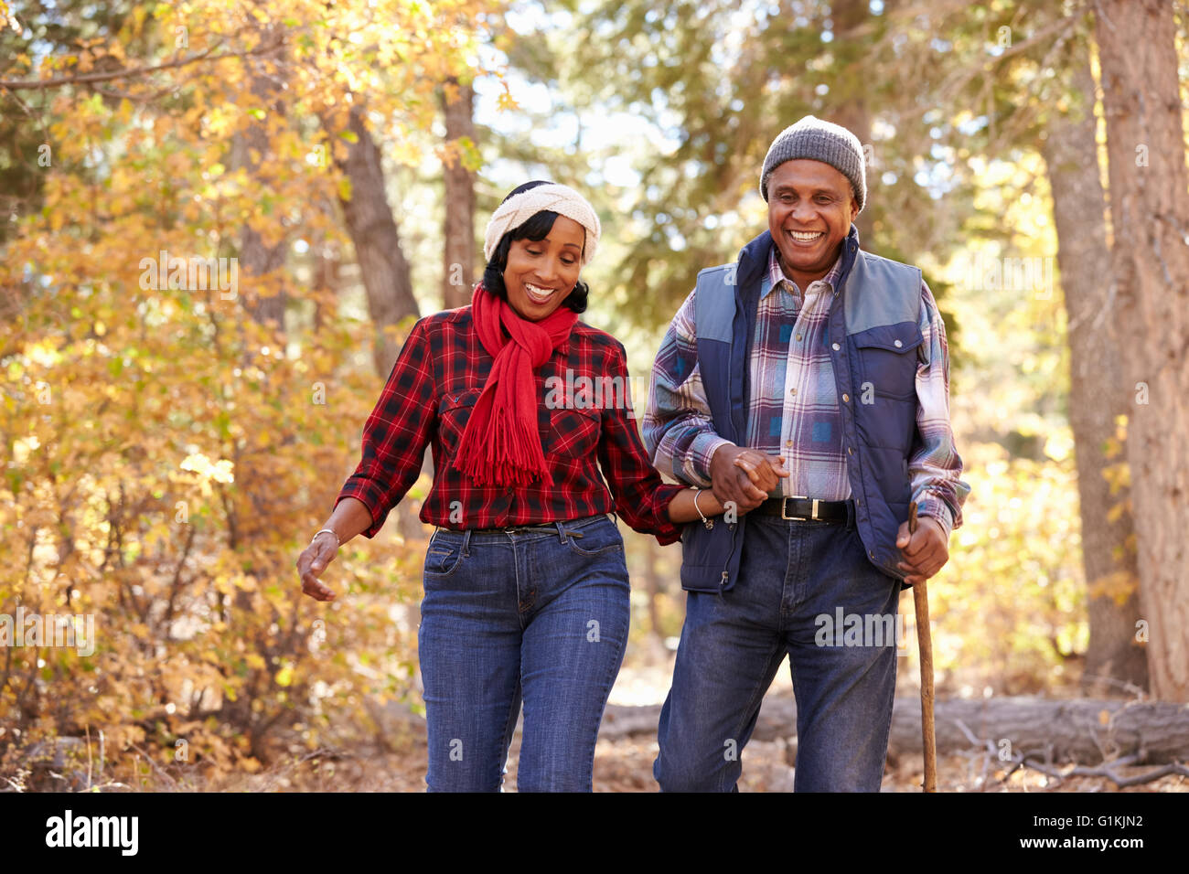 Senior African American Couple Walking Through Fall Woodland Stock ...