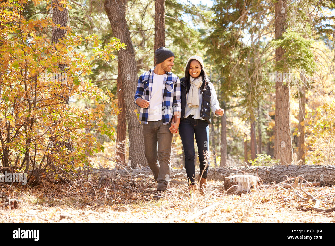 African American Couple Walking Through Fall Woodland Stock Photo - Alamy