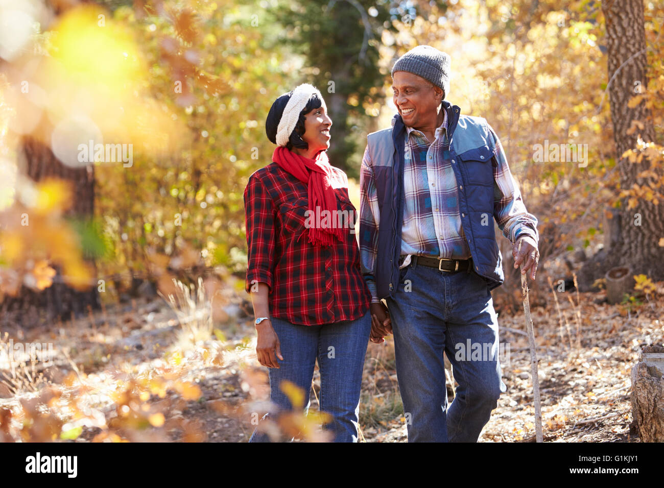 Senior African American Couple Walking Through Fall Woodland Stock ...