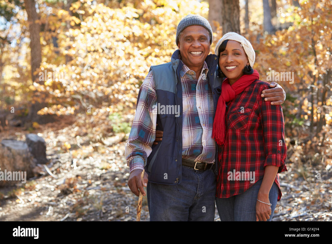Senior African American Couple Walking Through Fall Woodland Stock ...