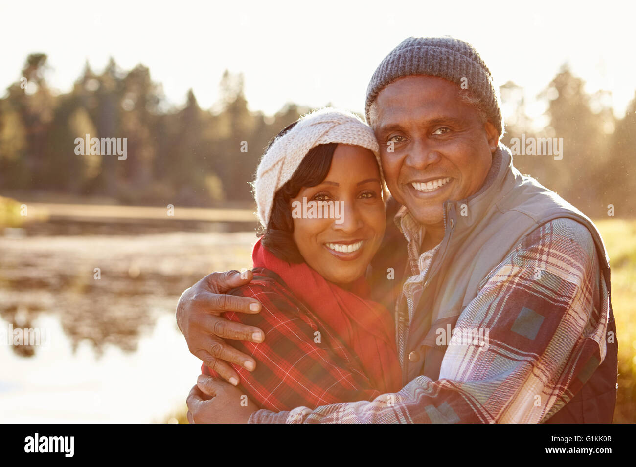 Portrait Of Senior African American Couple Walking By Lake Stock Photo ...
