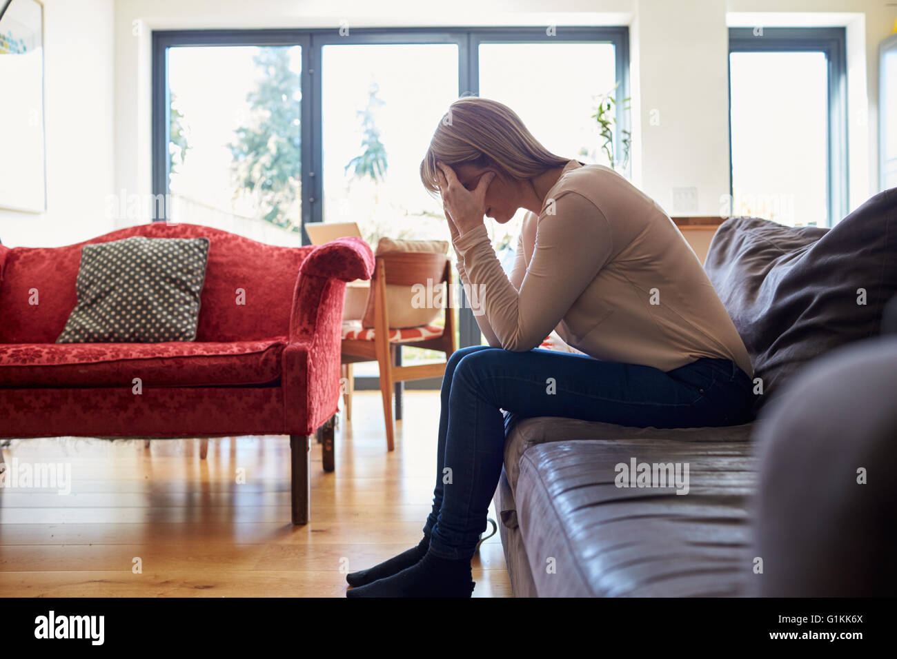 Mature woman home sofa hi-res stock photography and images - Alamy