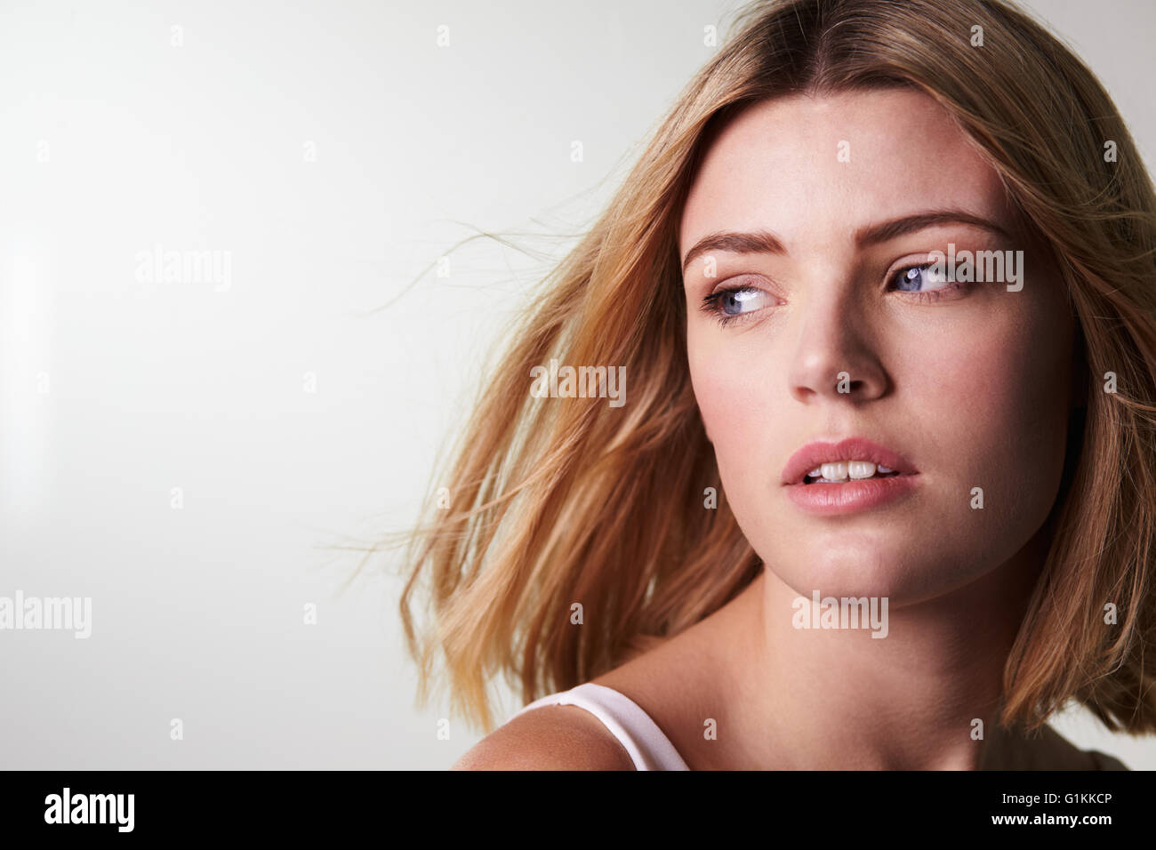 Young blonde woman looking away, close up horizontal Stock Photo