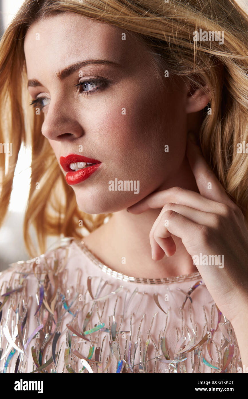 Glamorous blonde woman looking away, vertical portrait Stock Photo
