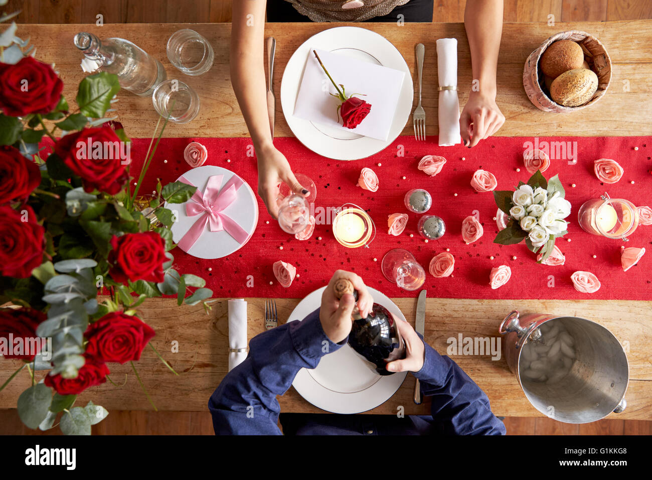 Overhead View Of Romantic Couple At Valentines Day Meal Stock Photo