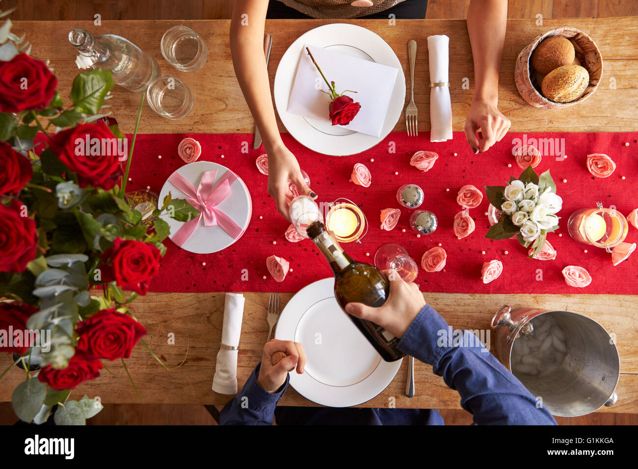 Overhead View Of Romantic Couple At Valentines Day Meal Stock Photo