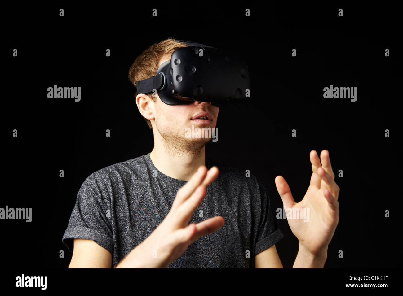 Young Man Wearing Virtual Reality Headset In Studio Stock Photo - Alamy