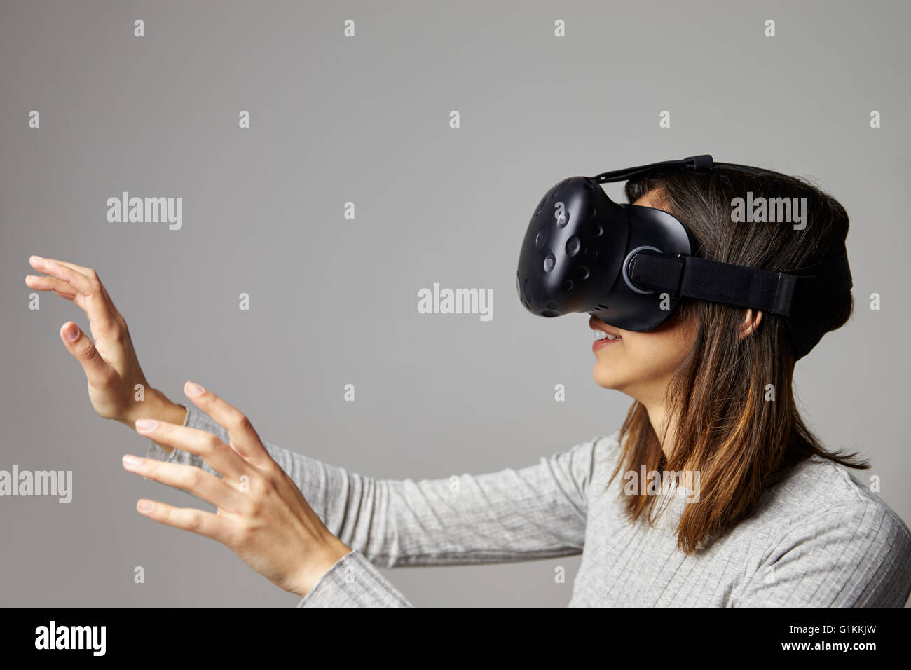 Man Sitting On Sofa At Home Wearing Virtual Reality Headset Stock Photo ...