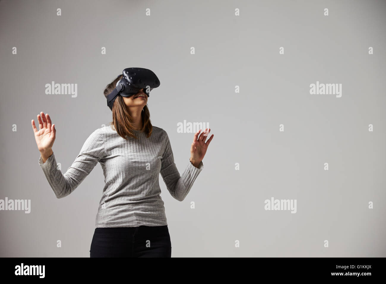 Man Sitting On Sofa At Home Wearing Virtual Reality Headset Stock Photo ...