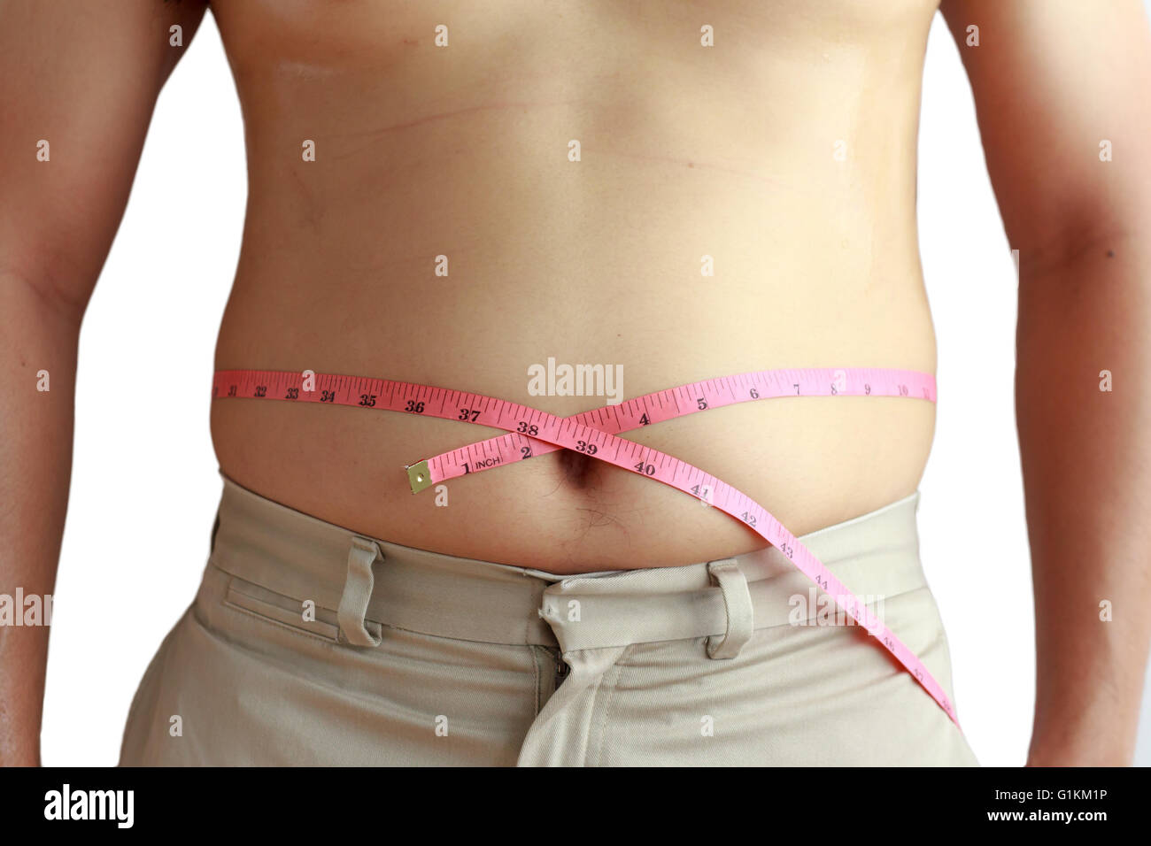 Fat man holding a measuring tape . Stock Photo