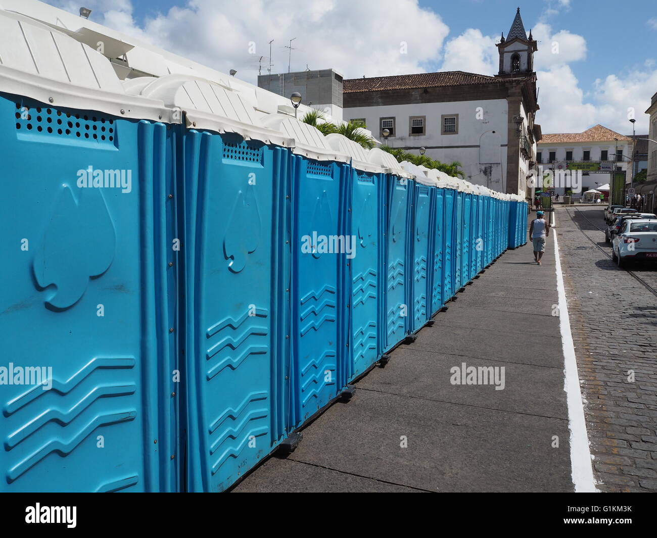 A row of blue toilets / lavatories / loos prepared in readiness for