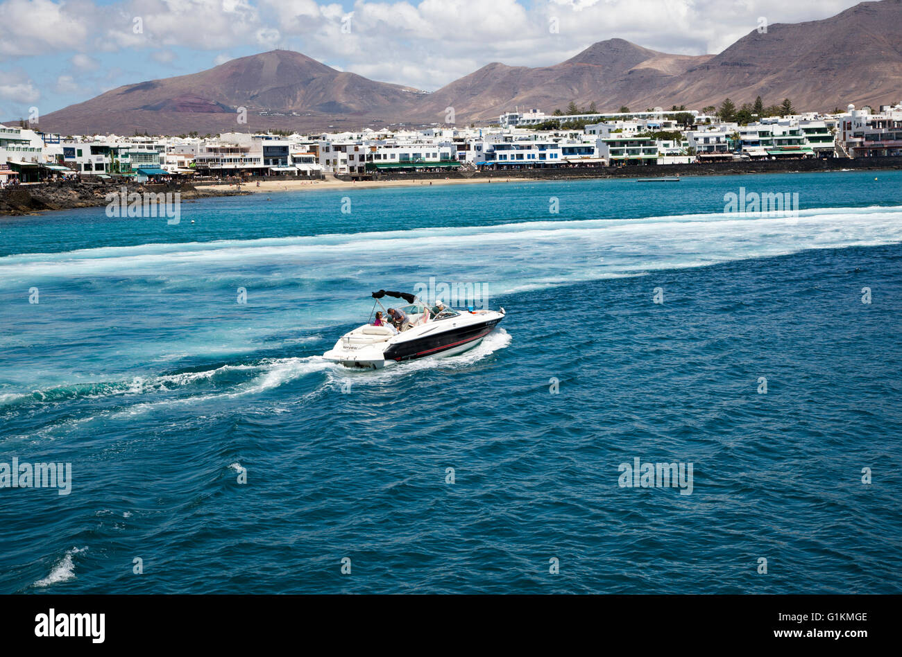 Motor boat leaving harbour at Playa Blanca, Lanzarote, Canary Islands, Spain Stock Photo