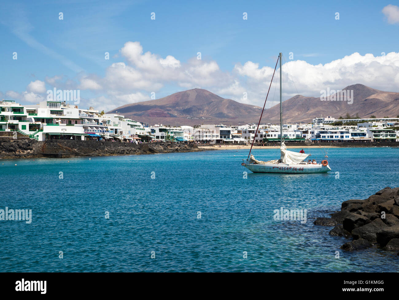 Yacht arriving in harbour at Playa Blanca, Lanzarote, Canary Islands, Spain Stock Photo