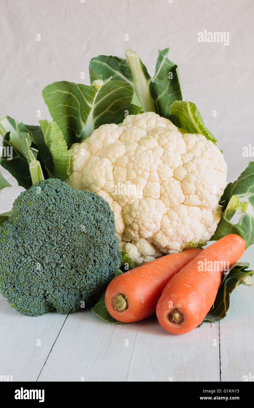Nice fresh natural cauliflower head with leaves broccoli and carrots