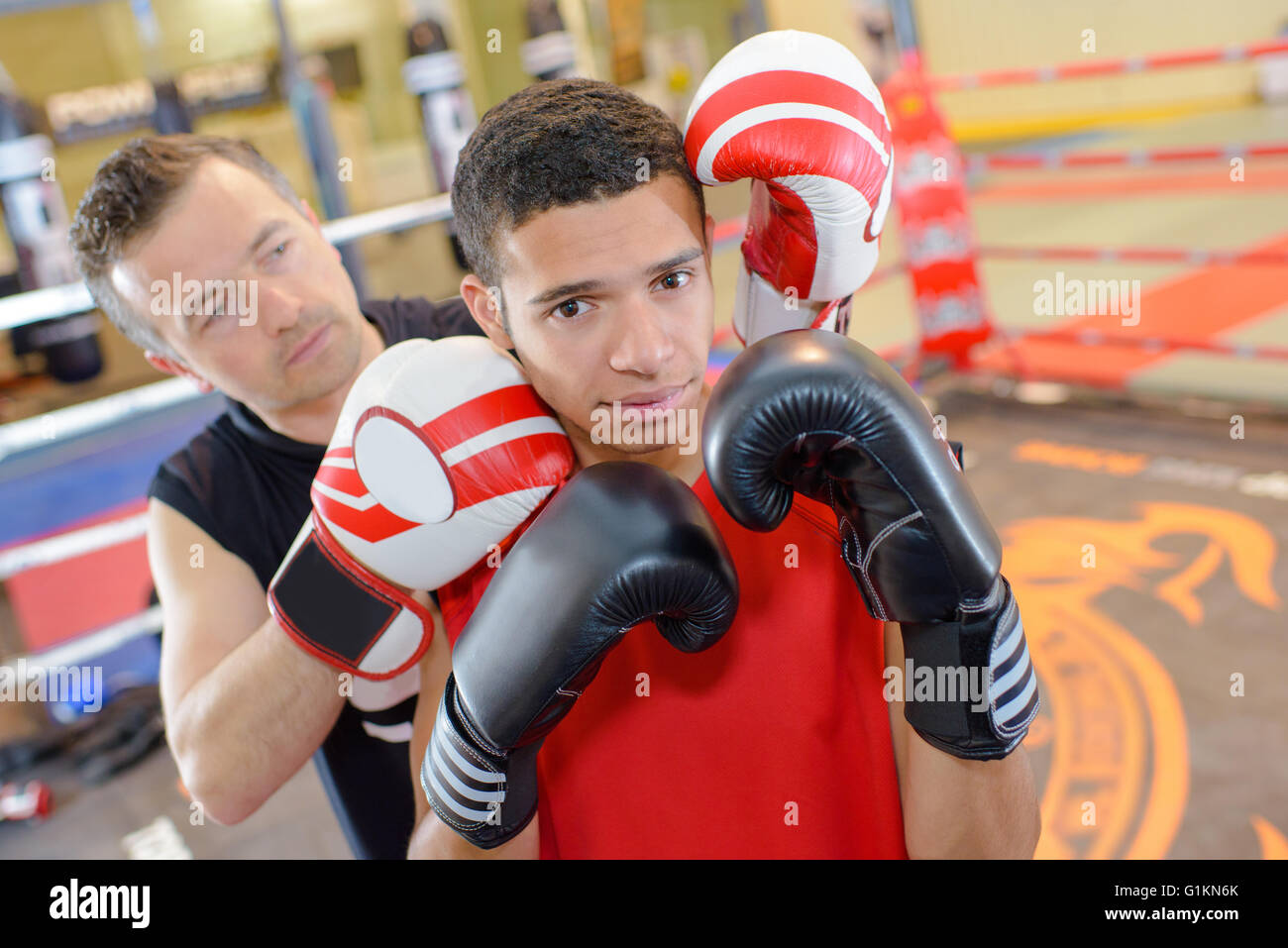 Young man with boxing instructor Stock Photo