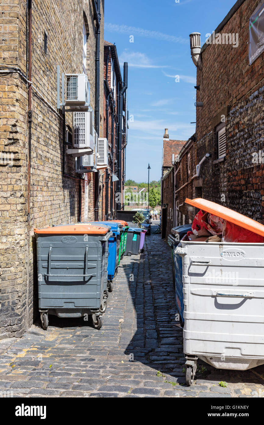 Waste and recycling bins in an historic Alley "Bell Lane", Sandwich, Kent, England, UK Stock