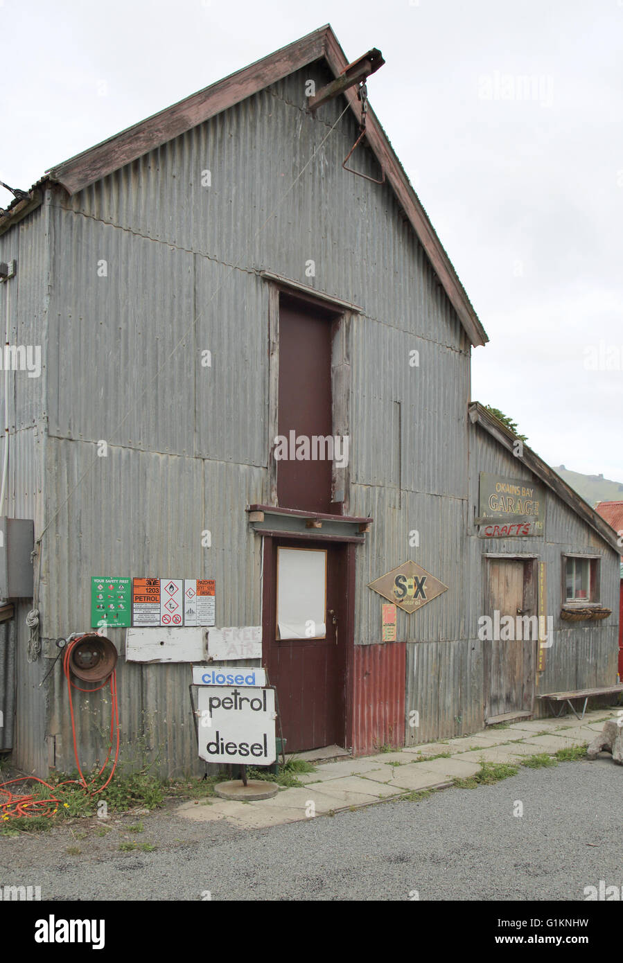 old disused garage in okains bay on the coast of new zealand Stock Photo