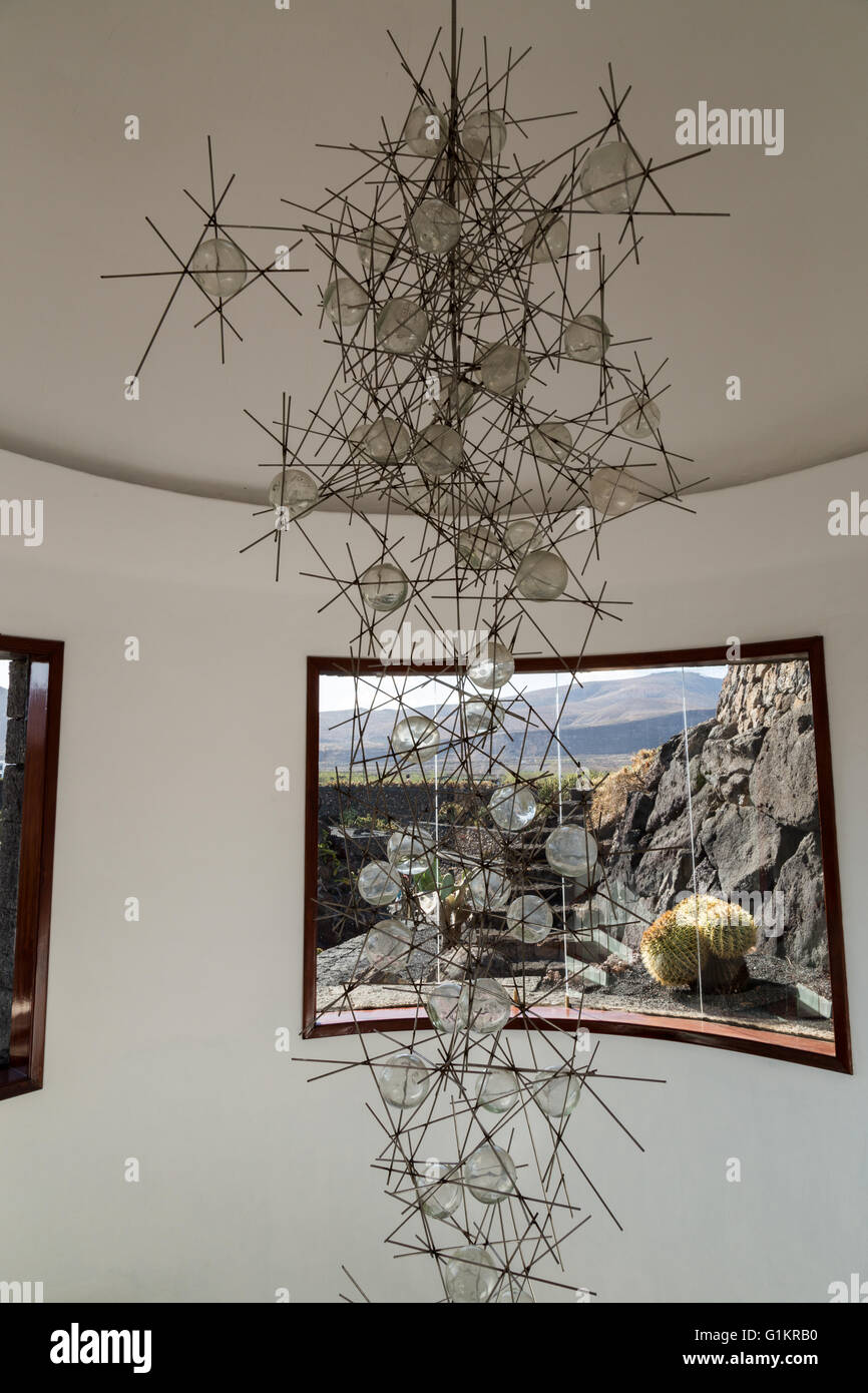 Glass and metal chandelier / artwork inside a helical staircase at the Lanzarote Cactus Garden. Designed by César Manrique. Stock Photo