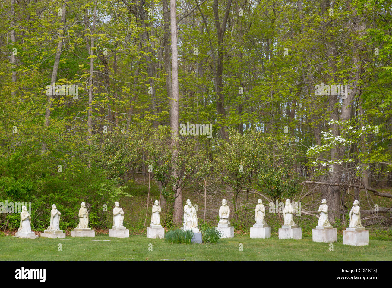 cemetery statues in wood area Stock Photo Alamy
