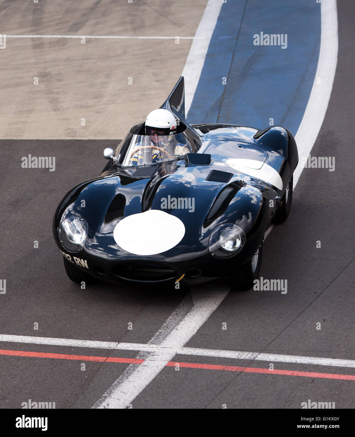 Jaguar D-Type, driven by Gary Pearson, leaving the pit lane during the Silverstone Classic Media Test Day 2016 Stock Photo