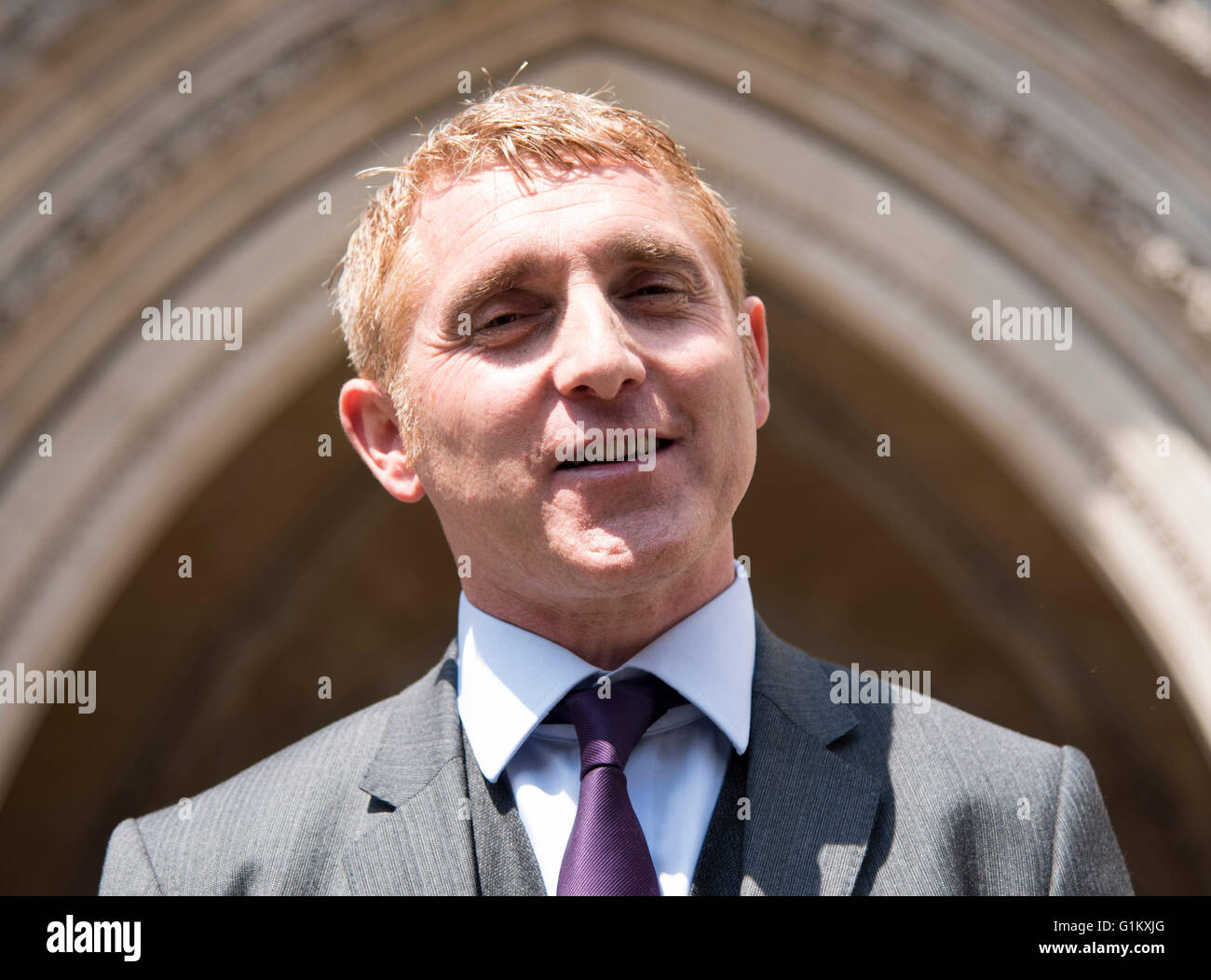 Pic shows Jonathan Platt centre outside the High Court in London today after winning his case