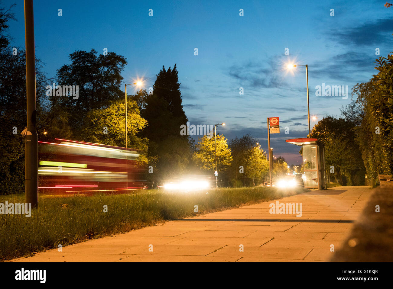 North Circular bus stop night bus street lamps Stock Photo