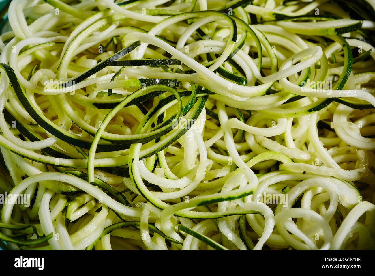Spiral cut green zucchini squash, raw, fresh, and ready for cooking