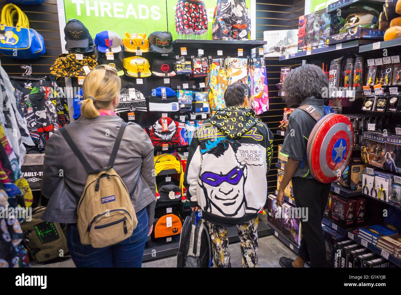 Shoppers browse merchandise at the opening of GameStop s ThinkGeek