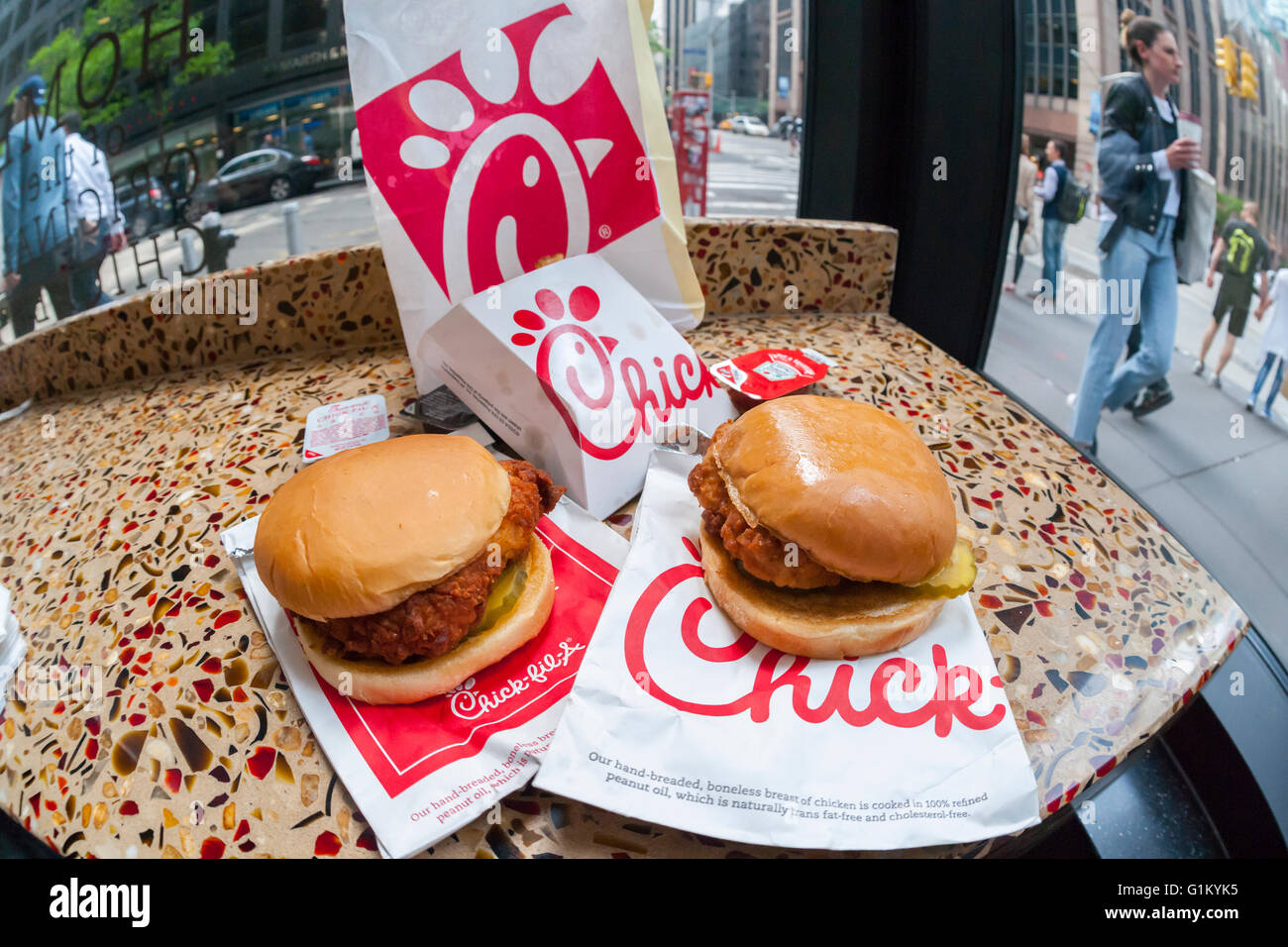 A classic Chick-Fil-A chicken sandwich and a Spicy Chicken sandwich in a Chick-Fil-A restaurant in New York on Saturday, May 14, 2016. New York Mayor Bill de Blasio recently called on New Yorkers to boycott the restaurant chain because of the religious beliefs of its president, Dan Cathy. The chain's popular two Manhattan operations see lines snaking out the door and has plans to open 12 more locations in New York. (© Richard B. Levine) Stock Photo