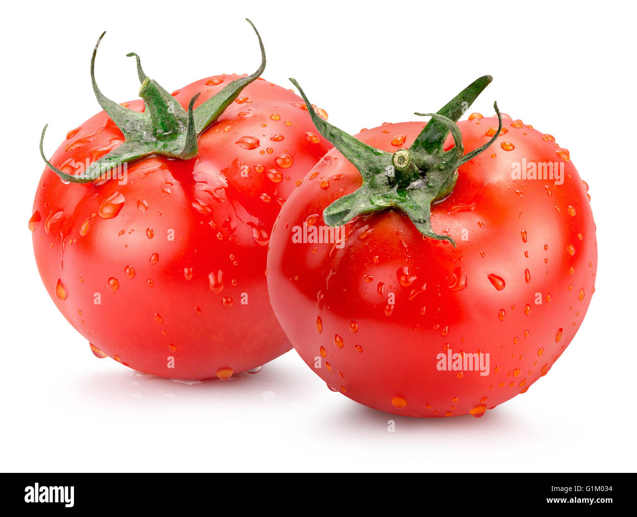 tomatoes with water drops isolated on the white background. Stock Photo