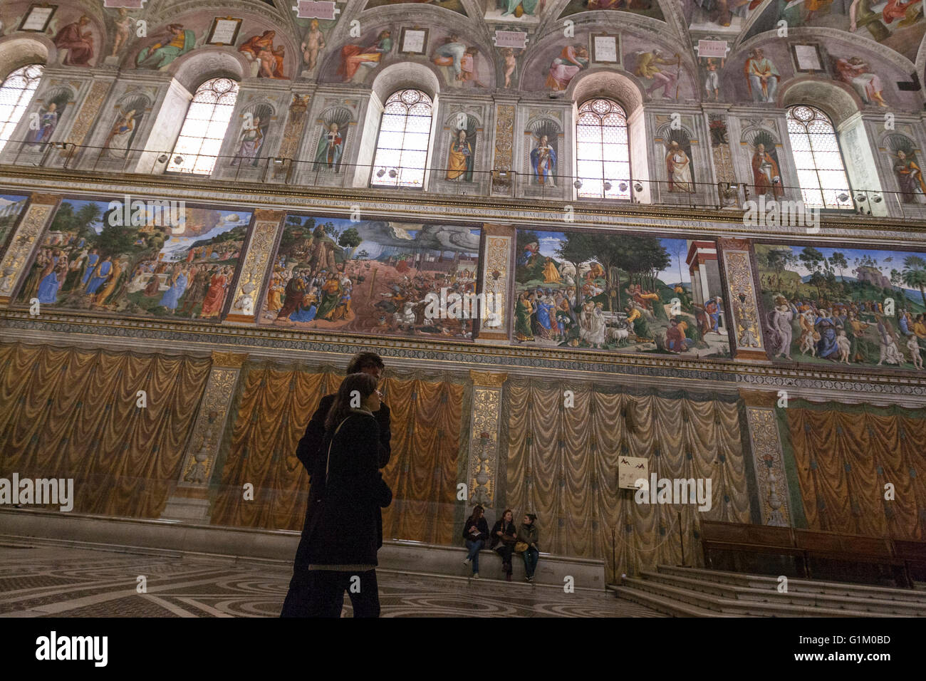 Tourists Observing The The Sistine Chapel Ceiling Painted By