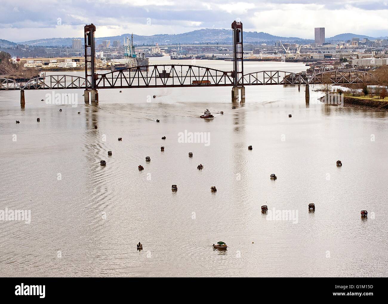 Dozens of fishing boats spread out along the Willamette River at the opening of sturgeon season in Portland, Oregon. Stock Photo
