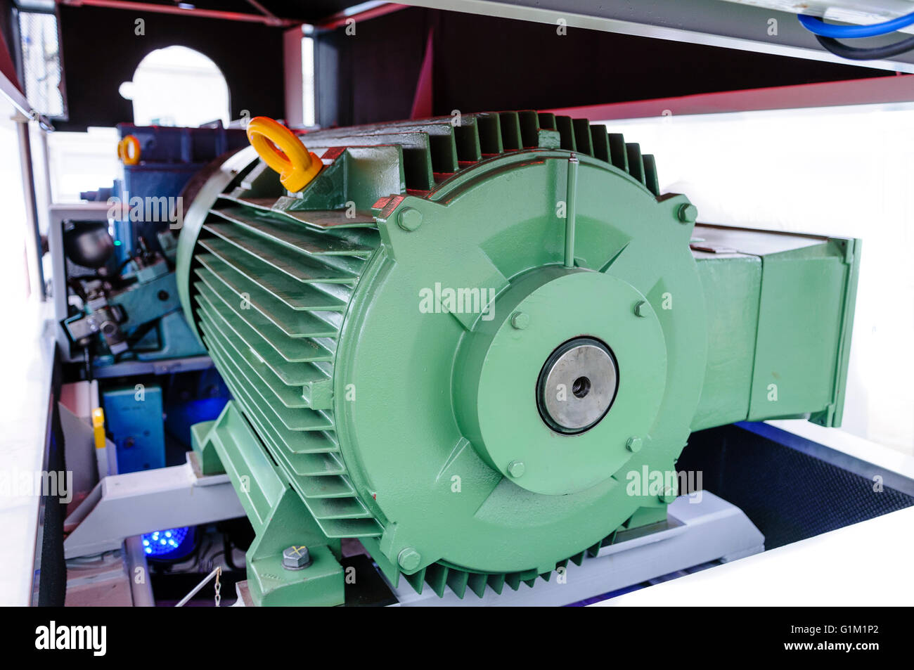 Electric generator inside the casing of a large wind turbine. Stock Photo