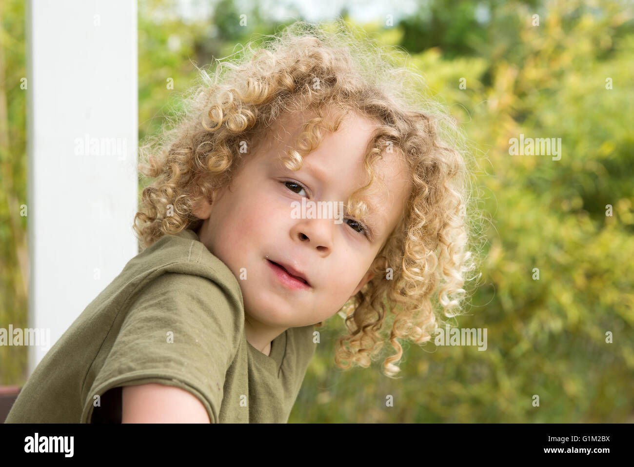 A Portrait Of A Young Boy With Blond Curly Hair Stock Photo Alamy a-portrait-of-a-young-boy-with-blond-curly-hair-stock-photo-alamy