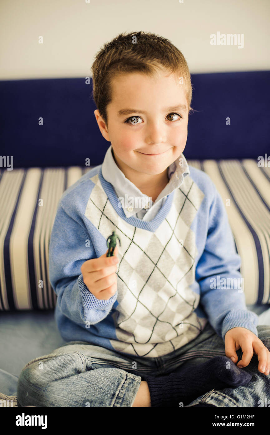 Caucasian boy holding toy soldier Stock Photo
