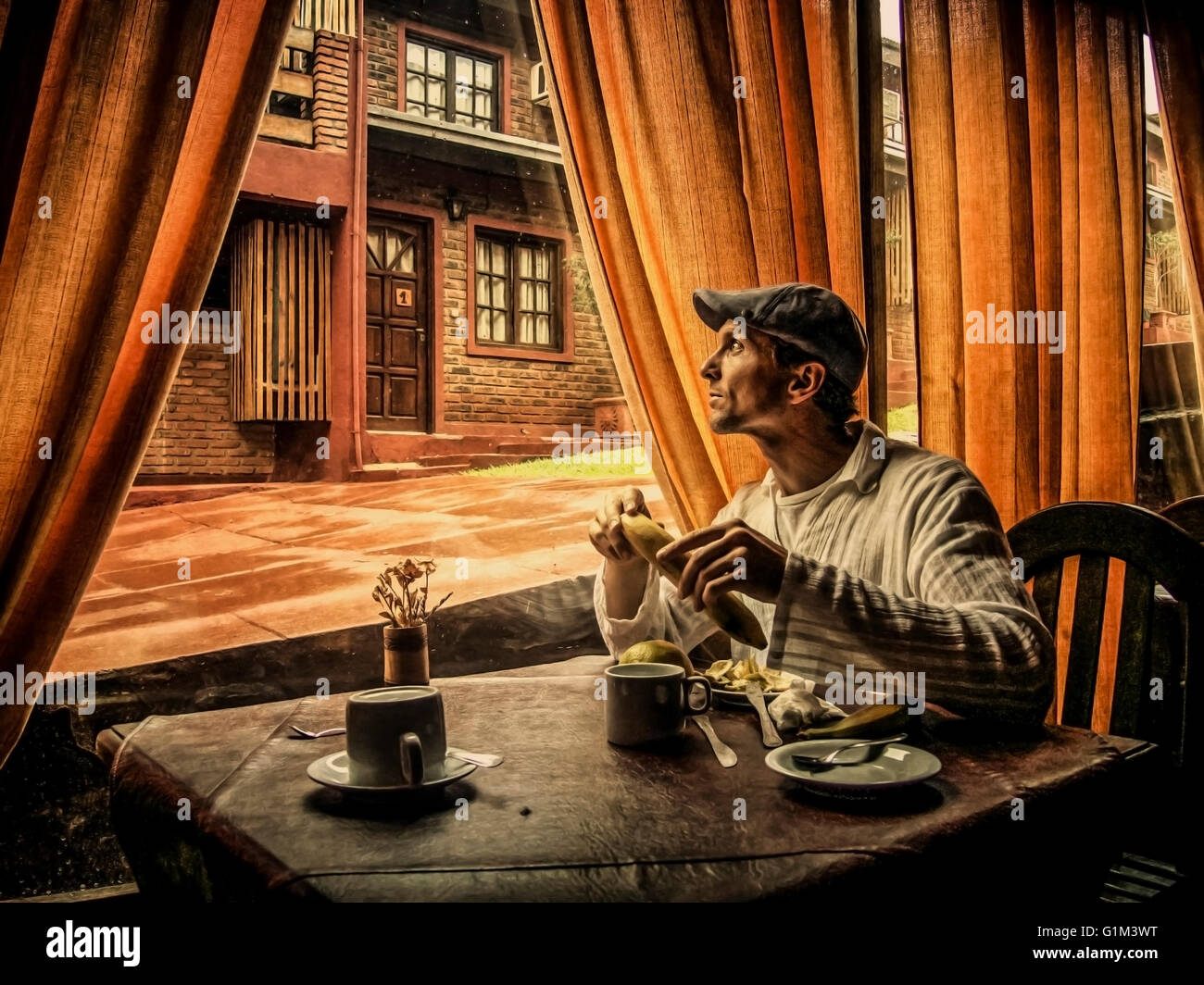 Caucasian man eating in cafe Stock Photo