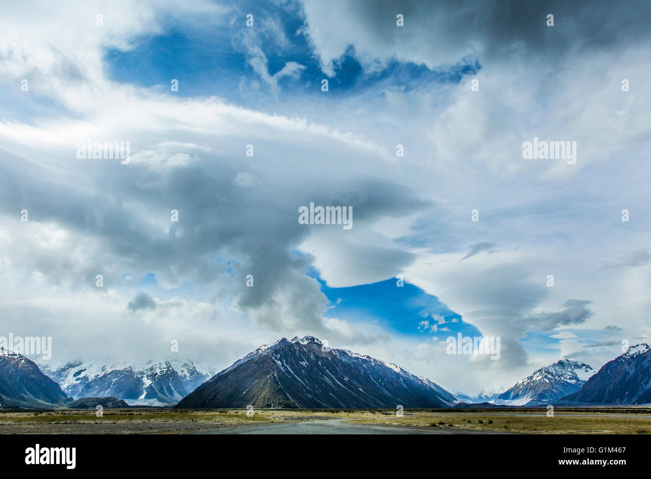 Cloudy sky over mountains and remote landscape Stock Photo - Alamy