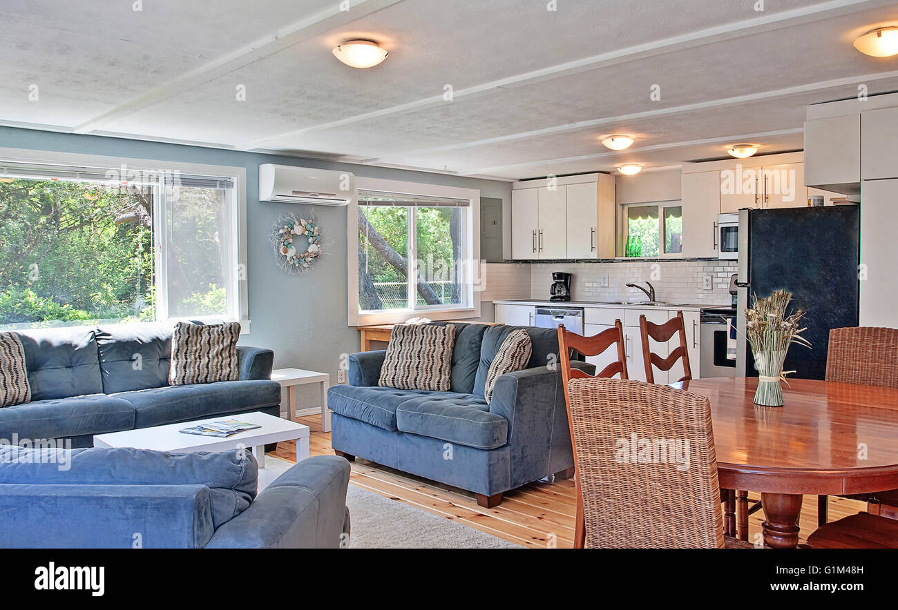 Sofas and dining table in modern living area Stock Photo