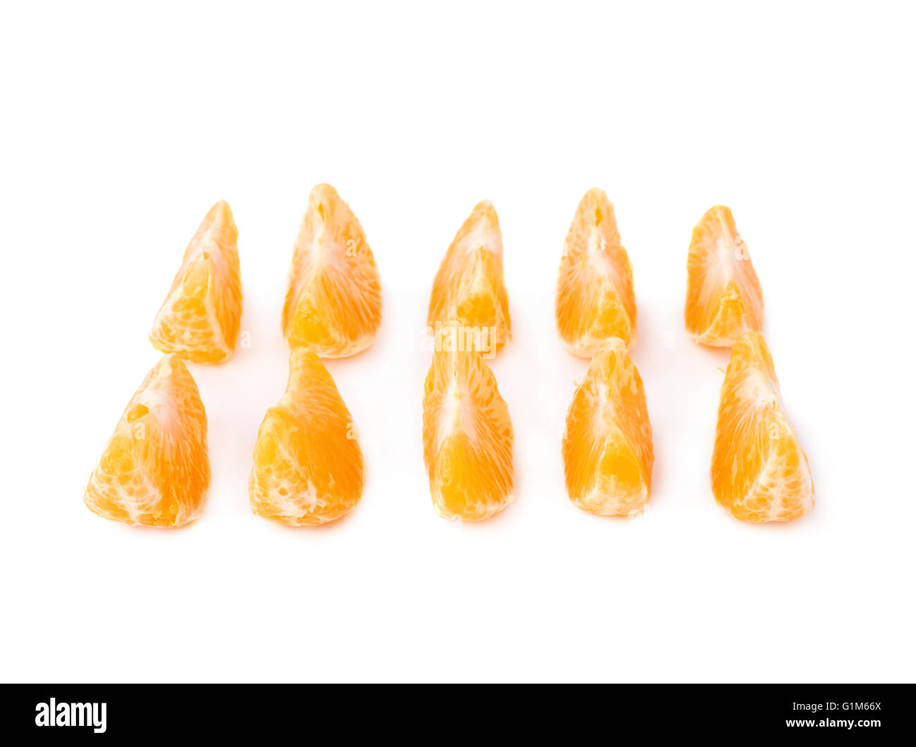 Slice sections of tangerine isolated over the white background Stock