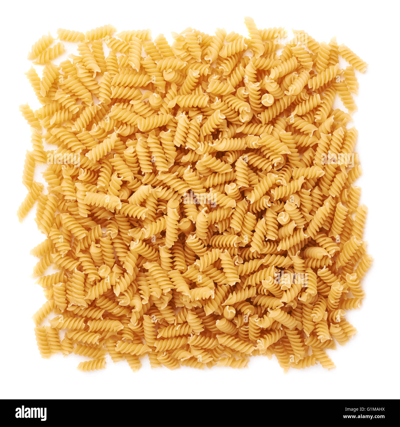 Pile of dry rotini pasta over isolated white background Stock Photo Alamy
