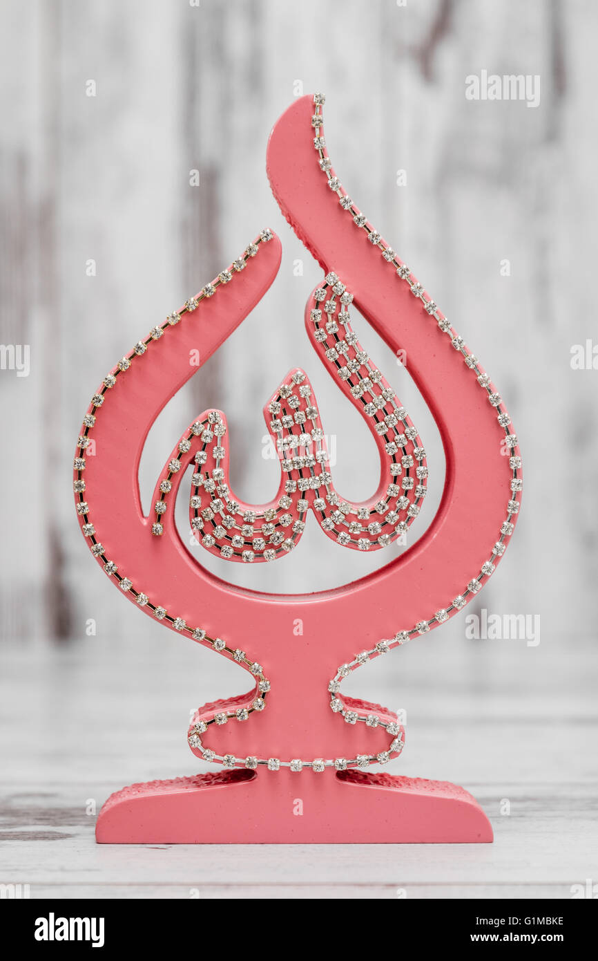Pink Religious statuette with the name of Allah, the God written ...