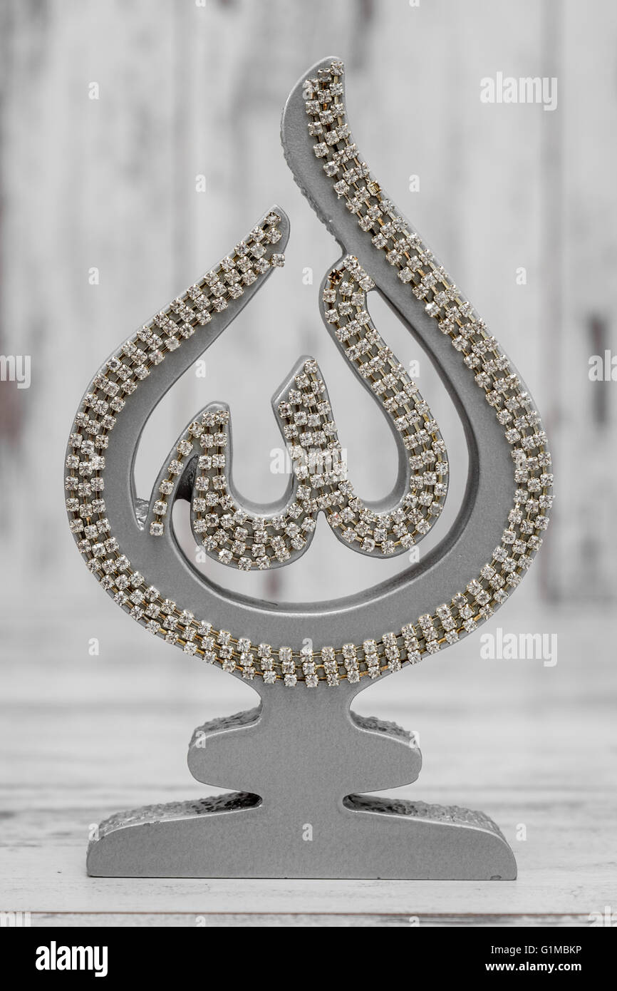 Silver and Golden Religious statuettes with the name of Allah, the ...